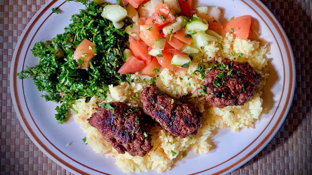 #2 Kofta Kabob · Mix of ground lamb and beef with onion, parsley, and our special seasonings. Includes rice, optional House Salad (Tabouli, Mediterranean Salad, Red and Green Pickled Cabbage, Potato Salad and Salsa).