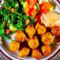 #14 Falafel · Ground garbanzo beans, potatoes, garlic, parsley, onions, spices, fried and served with tabo...