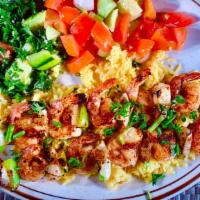 #11 Shrimp Kabobs · Two kabobs grilled with special seasoning topped with garlic and lemon. Includes rice, optio...