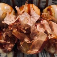 Takoyaki (6) · Crispy fried dough on the outside with a light and airy inside with a piece of octopus in th...