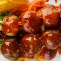 Deep-Fried Pork Meatballs (4) · This portable Thai-style street food is four pork meatballs on a stick that is deep-fried an...