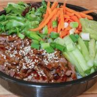 Cow-Incidence Roll (Meat Eater Roll) · beef bulgogi, white rice & mixed greens, carrots, avocado, cucumber, teriyaki, & sesame seeds.