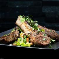 Flame Grilled Lamb Chops (3Pc.) · served on a bed of creamy mashed potatoes