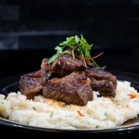 Ribeye Medallions (7Oz.) · Served on a bed of mashed potatoes