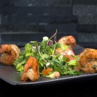 Shrimp Flambe (6Pc.) · Garlic & Chili | Buttered | Garlic Parmesan)
served on top of a fresh green salad