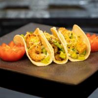 Tacos (3Pc.) · Shawarma | Shrimp | Fish)
served with fine chopped salad