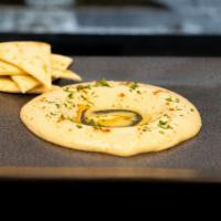 Garbanzo Dip · Hummus. dipping platter served with pita bread and tahini sauce. make it extra falafel shawa...