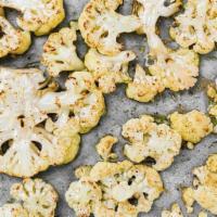 Baked Cauliflower · Vegan, gluten free. Whole cauliflower baked in olive oil, salt and pepper.