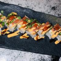 Dragon Roll · Spicy tuna, tempura fried shrimp, avocado, jalapeño. Topped with Japanese spicy mayo, eel sa...