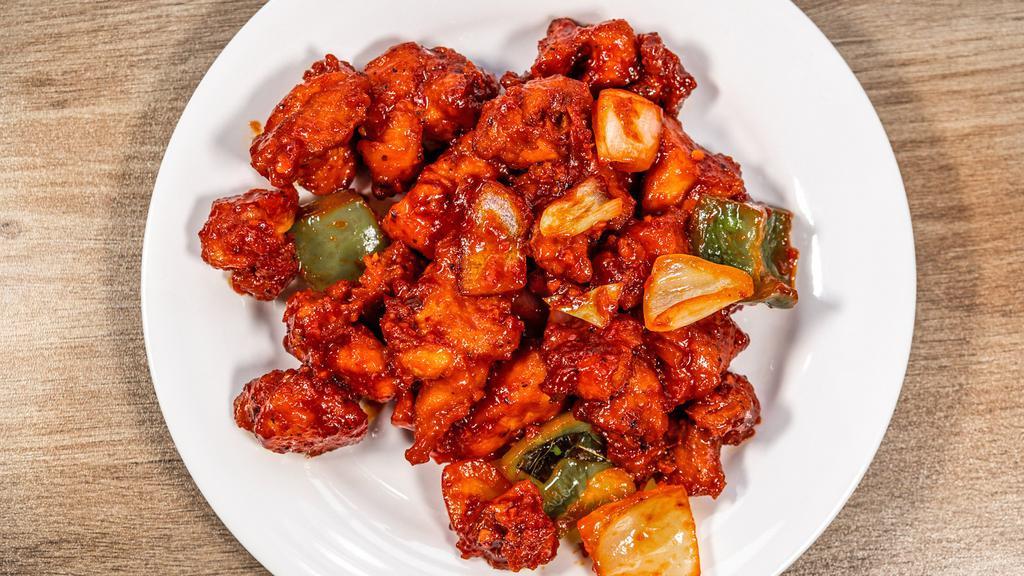 Chilli Chicken · Stir fried chicken with sweet pepper, green chilies, onions and aromatic Indian herbs.