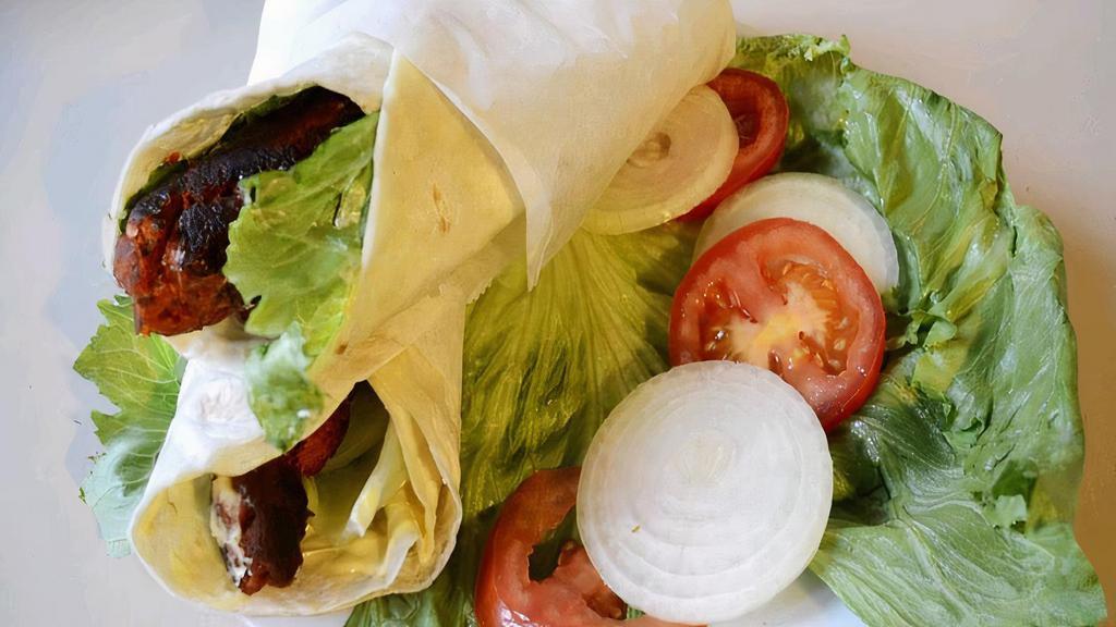 Sheek Kabob Wrap · Ground lamb sautéed with onion and wraps with chopped lettuce, cucumber and pickle.