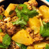 Aloo Gobi · Vegetarian. Cauliflower cooked with potatoes, peas and spices.