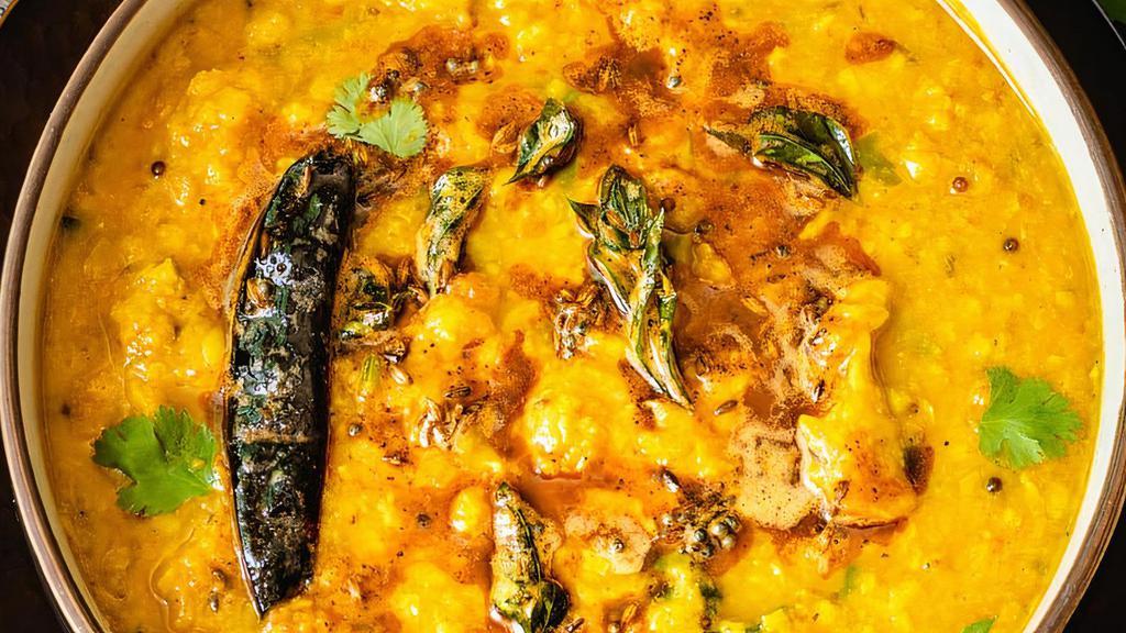Dal Tadka · Vegetarian. Traditional Indian yellow lentil cooked with spices, cumin, mustard, garlic and curry leaves.