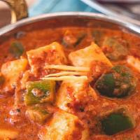 Kadai Paneer · Vegetarian. Paneer cooked with crushed whole spices, peppers, tomatoes and onions cooked in ...