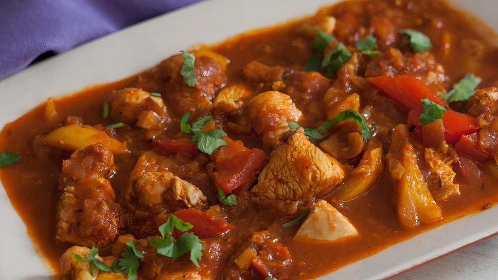 Chicken Jalfrezi · Boneless chicken cooked with roasted ground exotic spices and stir fry with vegetables.