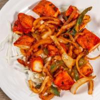 Chicken Tikka Kabob · Marinated and clay oven cooked boneless cubes of chicken sautéed with onion and green pepper.