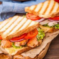 Bb'S Grilled Chicken Sandwich · Marinated chicken breast, pesto, roasted red pepper, lettuce, tomato, onions and provolone c...