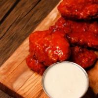 Boneless Wings · Crispy chunks of chicken breast tossed in any one of our wing sauces