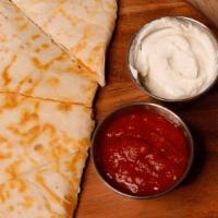 Quesadilla · Made on a fresh tortilla with lots of Monterey Jack and cheddar cheese, with sour cream and ...