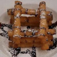 Funnel Cake Fries · Your favorite carnival treat topped with powdered sugar and chocolate sauce