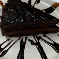 Chocolate Layer Cake · Three incredibly rich and moist layers of chocolate cake topped with a creamy chocolate fros...