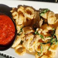 Calamari Fritti · Tender calamari, lightly fried, tossed with fresh lemon and basil with a side of spicy marin...