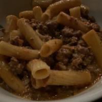 Bolognese · Slow simmered bolognese with beef, pork and herbs tossed with rigatoni pasta.