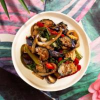 Vegan Stir-Fried Eggplant · Stir-fried eggplant, chiles, basil, garlic, onions, and bell peppers and your choice of tofu...