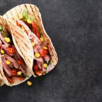 Beef Puffy Taco · Delicious puffy taco made with a folded tortilla with a variety of fillings including beef a...