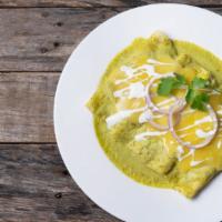 Green Chicken Enchiladas Plate · Delicious 3 white corn tortillas filled with shredded chicken topped with our distinctive gr...