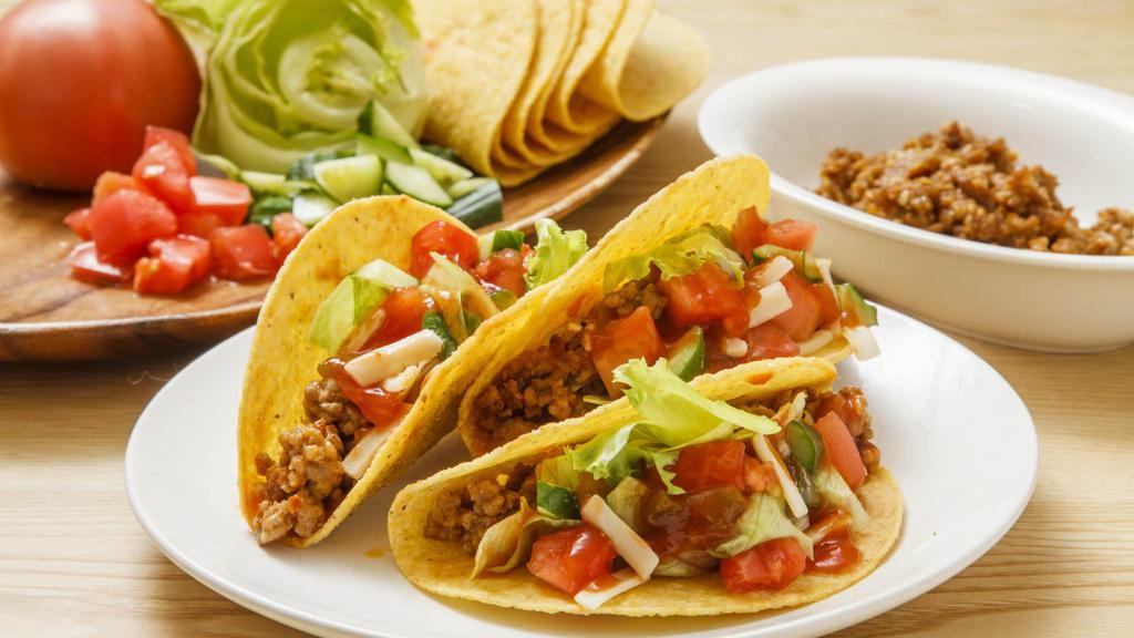Taco Plate · Yummy crispy or soft. 3 tacos filled with your choice of shredded chicken or ground beef topped with lettuce, tomato and American cheese.