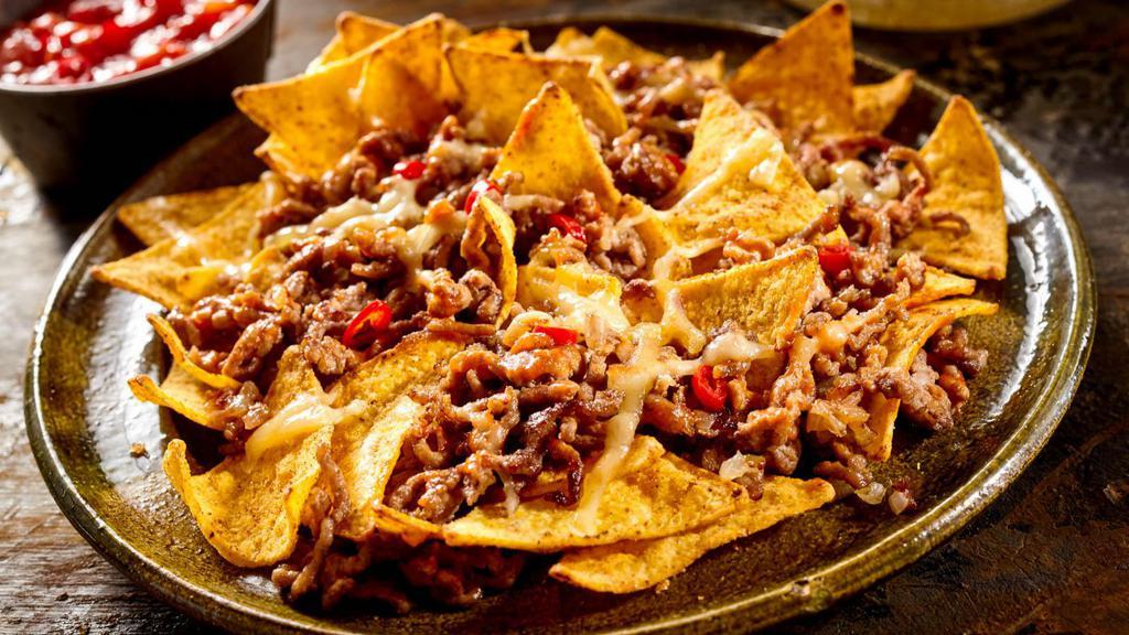 Beef Nacho Supreme · Yummy bean and cheese nachos with your choice of ground beef and a side of guacamole, sour cream and jalapeños.