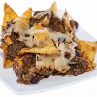 Bean And Cheese Nachos · Delicious bean and cheese nachos served with a side of jalapeños.