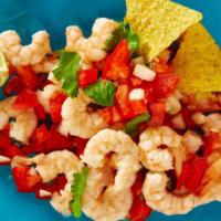 Shrimp Nachos · Delicious shrimp nachos served with mozzarella cheese without beans and jalapeños.