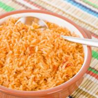 Rice · Delicious mexican rice made with tomatoes, garlic, onions.