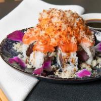 Fire Crunch Roll · Spicy tuna roll topped with salmon, spicy crabstick, tempura crunch, spicy and eel sauce.