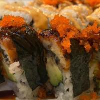 Dragon Roll · Whole piece of eel over California roll.