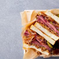 Pastrami Sandwich · Classic sandwich topped with, pastrami, mustard, mayo, mozzarella cheese, and pickles, serve...