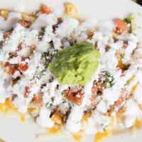 Carne Asada Fries · Wrinkled fries with carne asada melted cheese pico de gallo sour cream guacamole and cotija ...