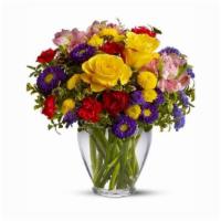 Brighten Your Day · With an abundant array of bright red, yellow and purple flowers, this arrangement is sure to...