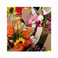 Loose Wrapped Flowers · Let us create a loose bouquet using the season's best available flowers within your budget. ...
