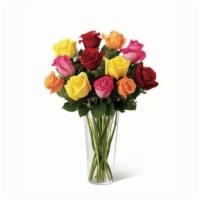 18 Colorful Rainbow Roses  · Beautiful hand picked roses in assorted colors designed in a glass vase with mixed greenery ...