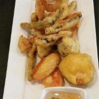 A12 Vegetable Tempura  · Deep fried battered mixed vegetables served with our tasty plum, and sweet and sour sauce.