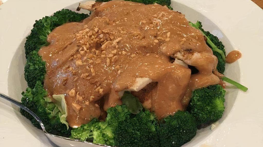 Hs2 Lemongrass Chicken · Chicken breast marinated with lemongrass, grilled to perfection, on bed of steamed broccoli, carrots, cabbages, spinach, and topped with peanut sauce.