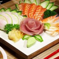 Chirashi · 12 pcs of assorted raw fish over seasoned sushi rice.