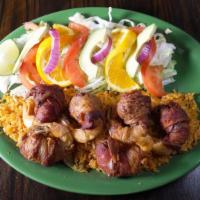 Camarones Locos · Six jumbo shrimp filled with oaxaca cheese, a slice of jalapeño and wrapped with bacon on a ...