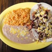 Steak & Bacon Tacos · Steak strips and bacon topped with cheese in two flour tortillas. Served with rice and beans.