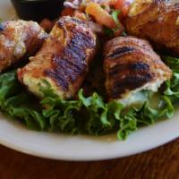 Cancun Chicken · Hickory smoked bacon wrapped around fresh tenderloin, stuffed with a slice of fresh jalapeno...