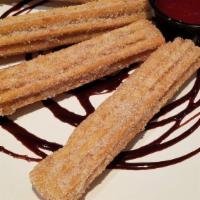 Caramel Churros · Mexican Dough Filled with caramel, Baked and Rolled in Cinnamon Sugar. Served with chocolate...