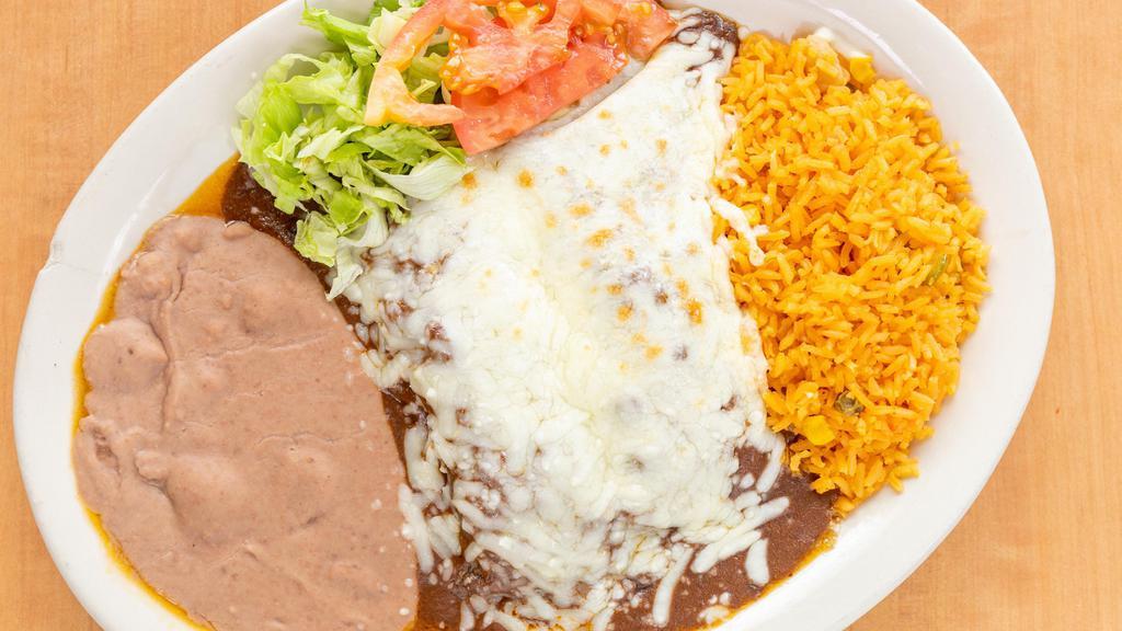Enchiladas De Mole · Two chicken enchiladas with our homemade mole sauce. Served with rice, beans and salad.
